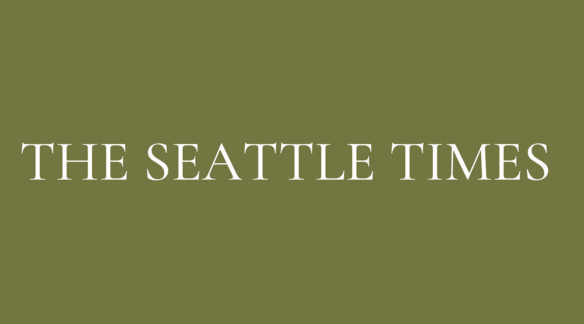 This is an olive green title page that reads Seattle Times.